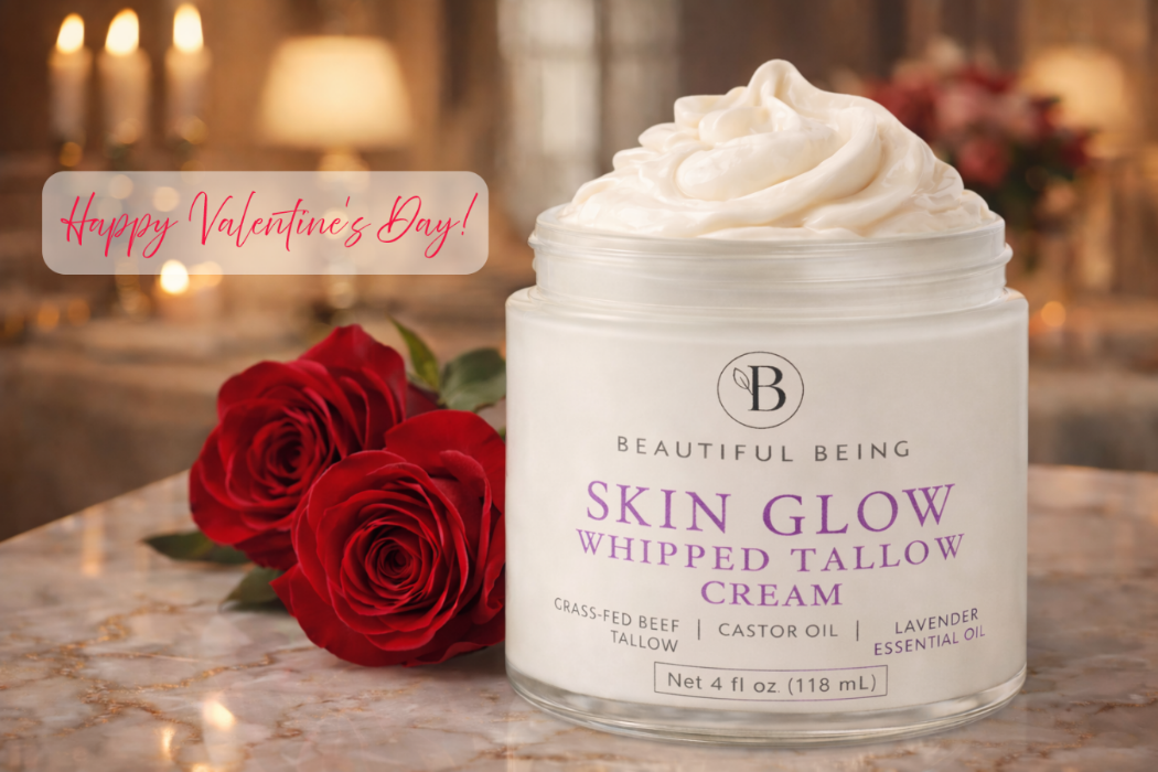 Jar of Skin Glow Whipped Tallow Cream with red roses on a decorative table, Valentine's Day message.